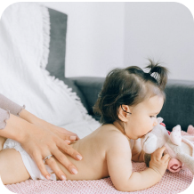 Baby receiving a gentle massage
