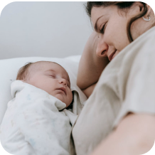 Mother resting with her baby